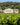 Photo of the winery building and surrounding vineyard of Domaine Pey Blanc