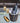 Bottle of Tanners English Sparkling Wine in an ice bucket with two glasse on a table.