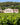 Photo of the winery building and surrounding vineyard of Domaine Pey Blanc