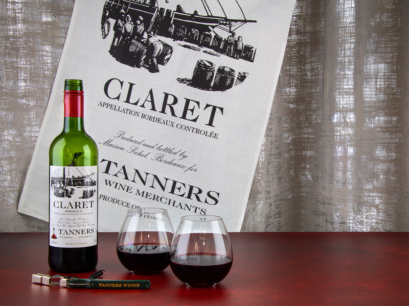 Claret wine bottle and glasses with Tanners Wine cloth and corkscrew