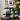 Wine bottles on a wooden stand with a Christmas tree in the background