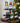 Wine bottles on a wooden stand with a Christmas tree in the background