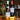 Two wine bottles and two wine glasses arranged on a gold tray in front of a decorated Christmas tree. The center bottle is a lovely bottle of Chablis, Les Valéry and the right bottle a brilliant Château Cissac, Haut-Médoc.